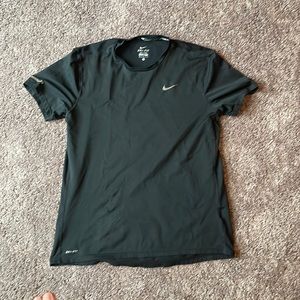 Nike running dri fit t shirt. Small wear and tear front bottom right of shirt.